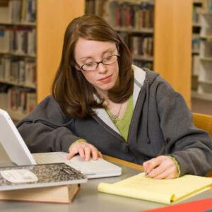 A female student studying in the library